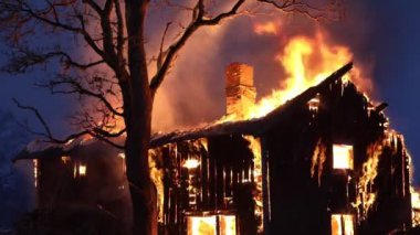 Burning house. Old wood house is burning. Fire