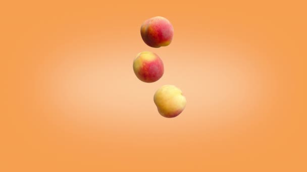 Três pêssegos caindo sobre um fundo laranja. — Vídeo de Stock