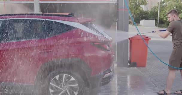 Young Boy Washes His Car Pressurized Water Self Service Car — Stockvideo