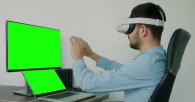 man wear VR-headset and interactive touch over air. VR headset glasses device. business man control by virtual reality. green screen concept