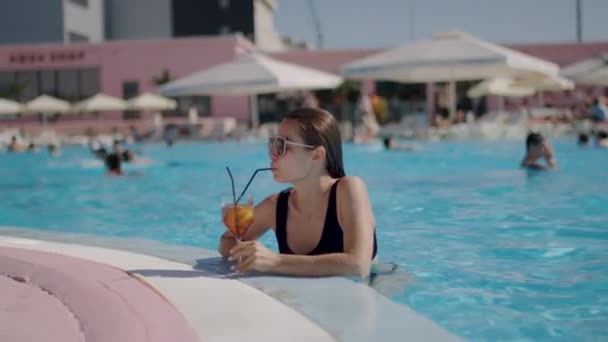 Woman Black Swimsuit Relaxes Deck Cocktail Pool — Stock Video