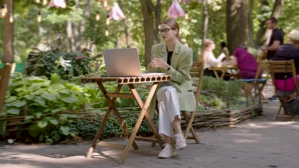 Happy Woman Headphones Communicating Video Call Being Conference Sitting Outdoors — 图库视频影像