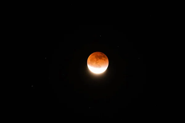Red moon during total Lunar Eclipse in May 2022. Copy space for text.