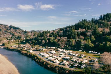 February 20, 2022: At Rivers RV Resort in Brookings Oregon USA next to Chetco River. Drone image.  clipart