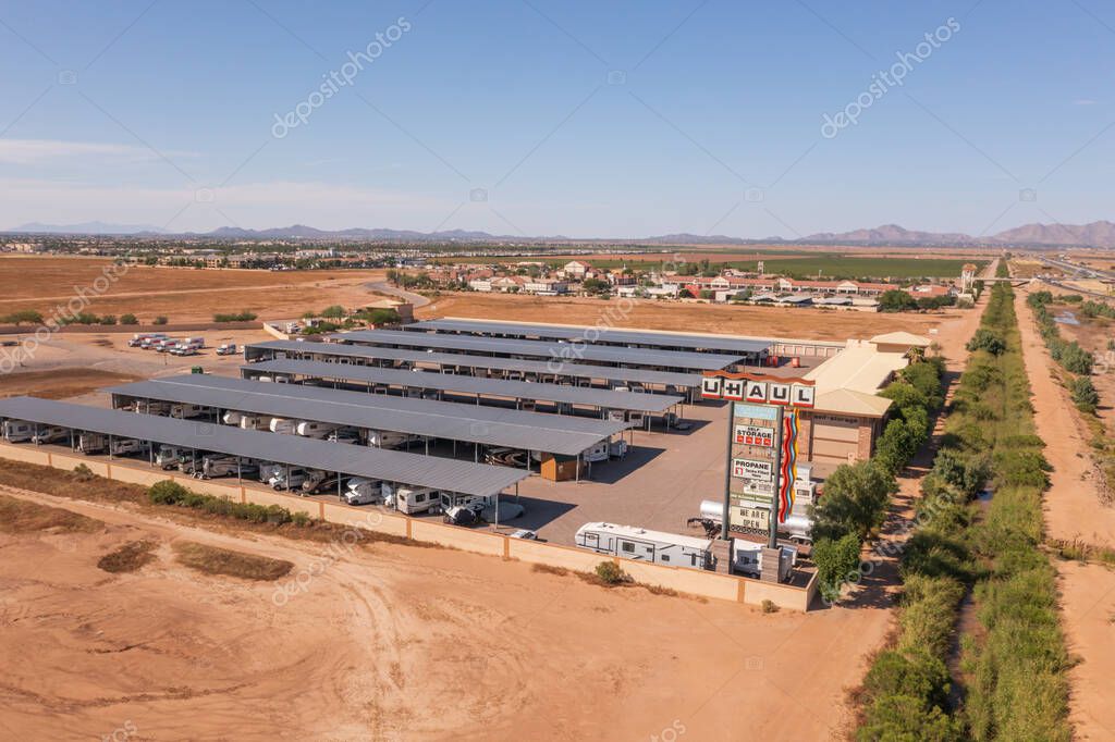Casa Grande, Arizona, USA, October 5, 2021. U-Haul self storage building with covered parking, aerial.