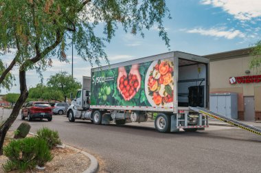 Green Valley, Arizona, July 14, 2022 - A Sysco truck driver unloads his truck at a restaurant in Arizona. 