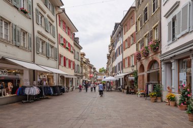 Rheinfelden, AG Switzerland - October 15, 2017. People and tourists walk through the charming old narrow streets and alleys in Rheinfelden. 