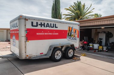 Green Valley Arizona, July 23, 2022. U-haul moving trailer parked in front of a residence. 