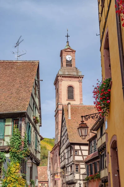 Equisheim, France. Old homes and church with beautiful architecture in Alsace.