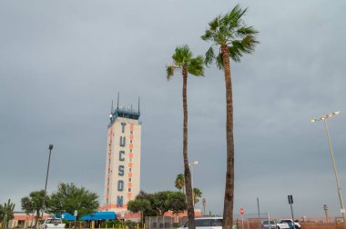 Tucson, Arizona, USA, July 28. 2022. Airport Tower Tucson International Airport, Arizona, USA. Palm trees in front of buildings. 