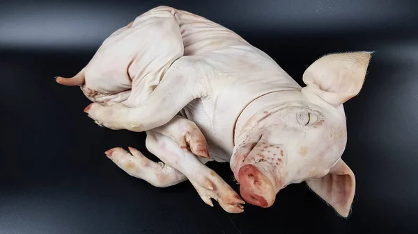Présentation Une Carcasse Porc Lait Sur Fond Noir Plats Fête Image En Vente