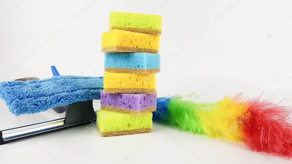 the cleaning company offers its house cleaning services. cleaning sponges, rags, cleaning products on a light background