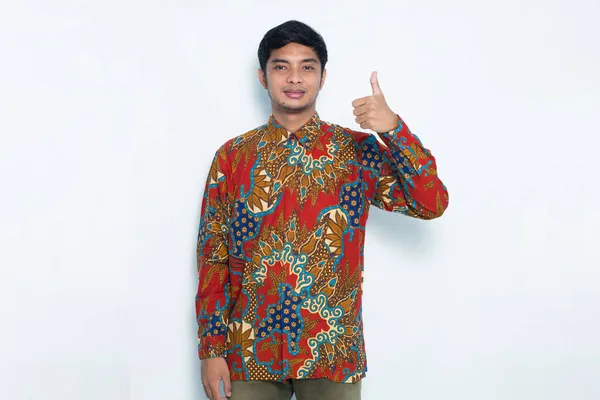 Asian Man Wearing Batik Sign Gesture Tumb Isolated White Background — Stock Photo, Image