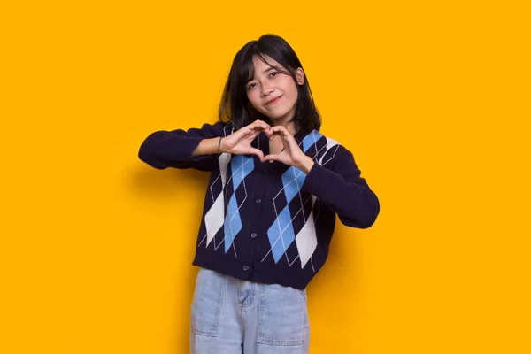 Asian Beautiful Young Woman Showing Heart Sign Love Isolated Yellow —  Fotos de Stock