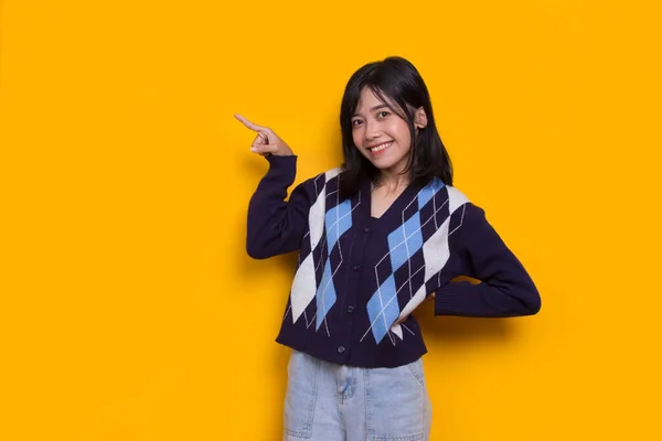 Young Asian Woman Pointing Fingers Different Directions Isolated Yellow Background — Stok fotoğraf