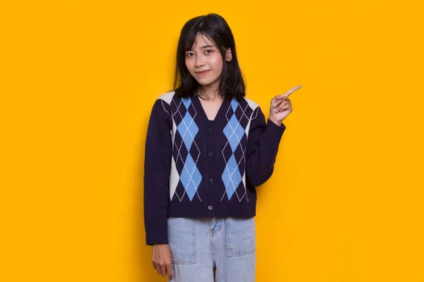 Young Asian Woman Pointing Fingers Different Directions Isolated Yellow Background — Foto de Stock
