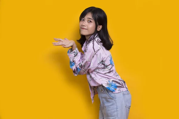 Young Asian Woman Pointing Fingers Different Directions Isolated Yellow Background — 图库照片