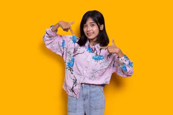 Young Asian Woman Pointing Fingers Different Directions Isolated Yellow Background — Foto de Stock