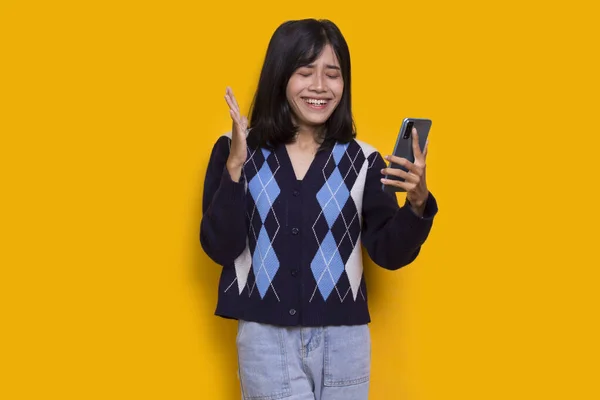 Happy Young Asian Beautiful Woman Using Mobile Phone Isolated Yellow —  Fotos de Stock