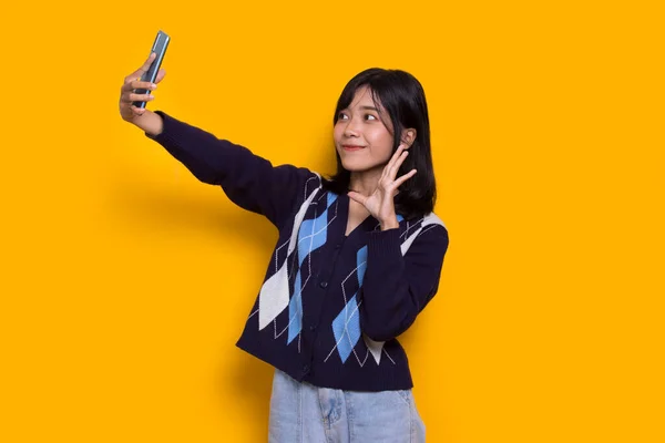 Happy Young Asian Beautiful Woman Using Mobile Phone Isolated Yellow — Foto Stock