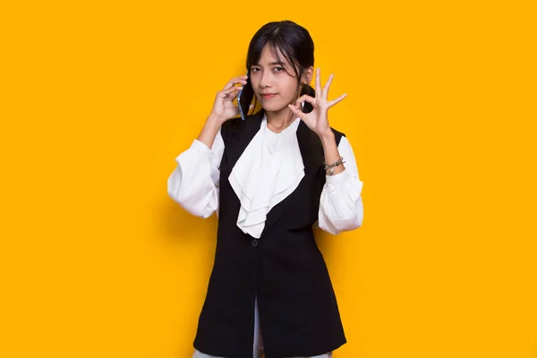 Happy Young Asian Beautiful Woman Using Mobile Phone Isolated Yellow — Stock Photo, Image