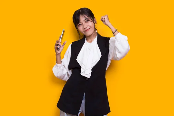 Happy Young Asian Beautiful Woman Using Mobile Phone Isolated Yellow — Stock Photo, Image