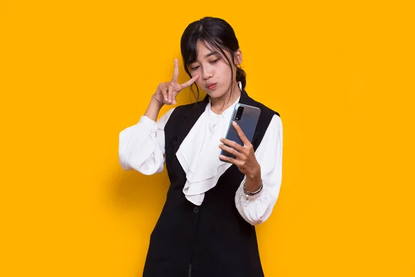 Happy Young Asian Beautiful Woman Using Mobile Phone Isolated Yellow —  Fotos de Stock