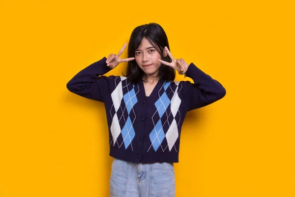 Beautiful Young Asian Girl Showing Peace Victory Hand Gesture Yellow — Stock Fotó