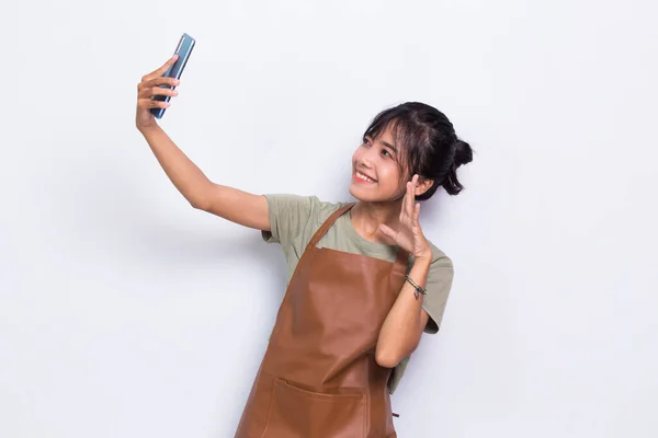 Happy Young Asian Barista Waitress Using Mobile Smartphone Isolated White — Stock fotografie