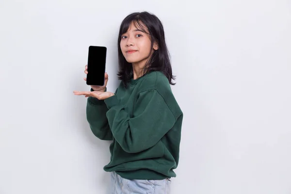 Young Beautiful Asian Cute Woman Demonstrating Mobile Cell Phone Isolated — стоковое фото