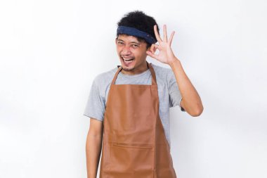 funny apron man smiling happy with ok sign gesture tumb up isolated on white background
