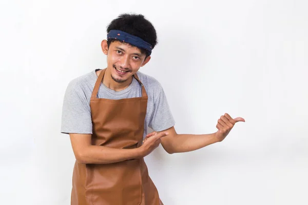 Happy Asian Man Barista Waitress Pointing Fingers Different Directions Isolated — Stock fotografie