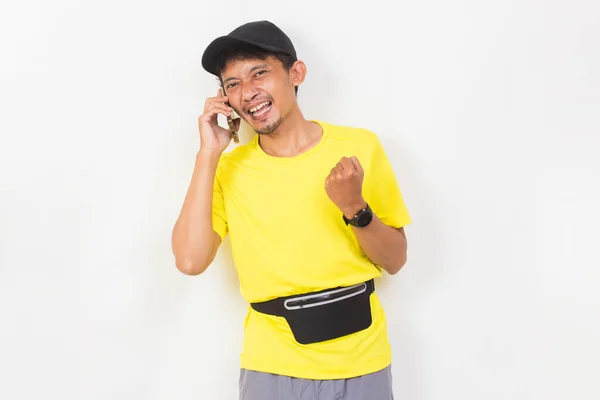 Asian Sporty Man Using Mobile Phone Isolated White Background — Stockfoto
