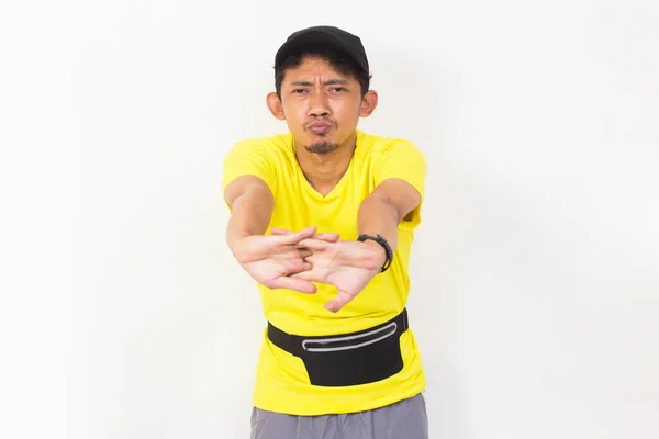 Asian Sporty Man Dressed Yellow Tshirt Doing Stretching Isolated White — Stockfoto