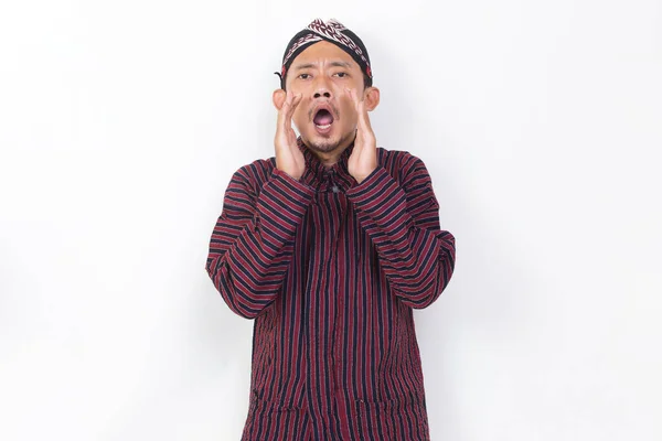 Asian Man Javanese Traditional Cloth Lurik Shouting Yelling Announcing Isolated — Stock fotografie