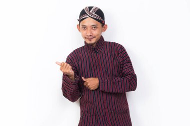 asian man with javanese traditional cloth lurik welcoming guests gretting isolated on white background