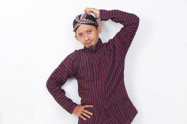 asian man with javanese traditional cloth lurik with headache on white background