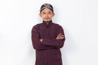 portrait asian man with javanese traditional cloth lurik isolated on white background