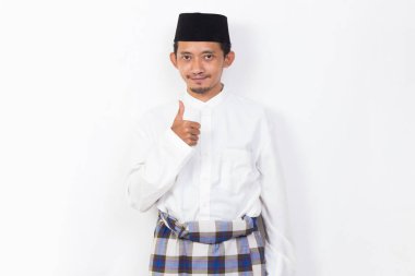 happy asian muslim man portrait showing thumbs up ok sign gesture isolated on white background