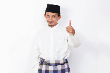 happy asian muslim man portrait showing thumbs up ok sign gesture isolated on white background