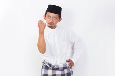 asian muslim man portrait with clenched into fists isolated on white background