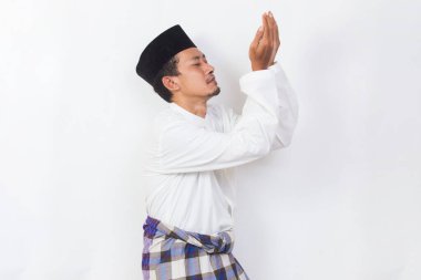asian muslim man praying isolated on white background