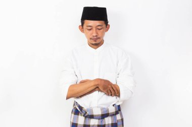 asian muslim man praying isolated on white background