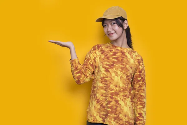 Young Asian Woman Pointing Fingers Different Directions Isolated Yellow Background — Stock Photo, Image