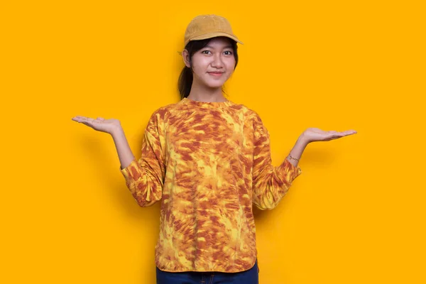 Young Asian Woman Pointing Fingers Different Directions Isolated Yellow Background — Stock Fotó