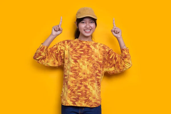 Young Asian Woman Pointing Fingers Different Directions Isolated Yellow Background —  Fotos de Stock