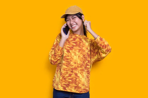Happy Young Asian Beautiful Woman Using Mobile Phone Isolated Yellow — Stok fotoğraf