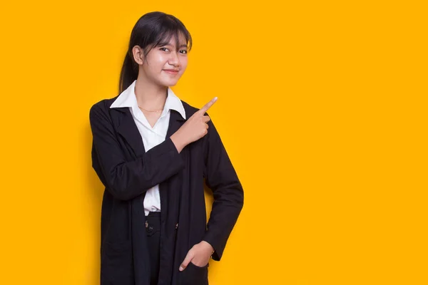 Young Asian Woman Pointing Fingers Different Directions Isolated Yellow Background — Stok fotoğraf