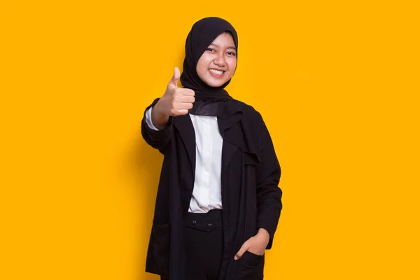 Young Asian Beautiful Muslim Woman Sign Gesture Tumb Isolated Yellow —  Fotos de Stock