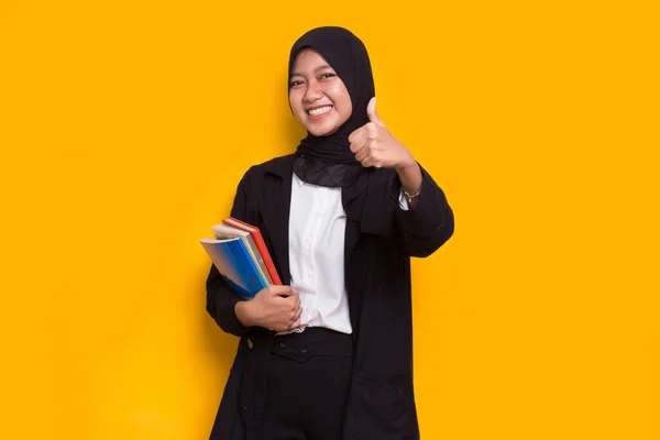 Beautiful Asian Muslim Business Woman Hug Book Isolated Yellow Background — Stock Photo, Image